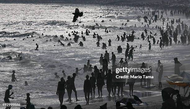 People jam Ipanema beach on the hottest day of the year so far on October 16, 2015 in Rio de Janeiro, Brazil. Temperatures peaked at 109 degrees in...