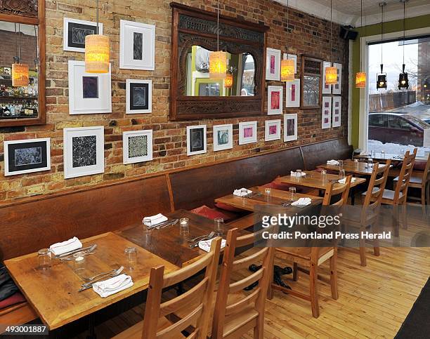 Thusday, March 4, 2011. Dining Guide Art at Figa at 249 Congress St. This warm-toned dining area features art on the brick walls and handmade,...