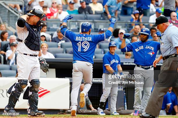 Jose Bautista of the Toronto Blue Jays celebrates a home run against the New York Yankees at Yankee Stadium on September 12, 2015 in the Bronx...