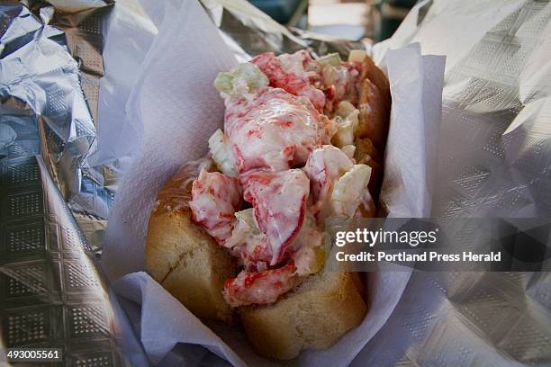 Lobster roll is ready to eat at A.J. Dog across the street from LL Bean in Freeport, on the first day of summer, Friday June 21, 2013.