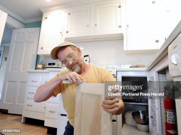 Thurs. May 2, 2013. Carpenter Peter Dunphy works on kitchen cabinet doors at a home in Cape Elizabet Thurs. May 2, 2013. Carpenter Peter Dunphy works on kitchen cabinet doors at a home in Cape Elizabet