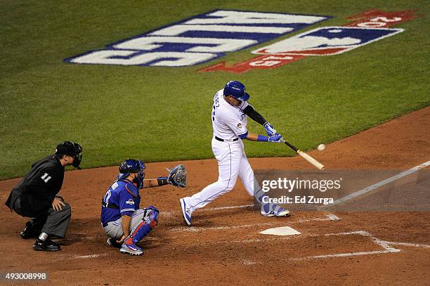 Salvador Perez of the Kansas City Royals hits a solo home run in the fourth inning against the Toronto Blue Jays during game one of the American...