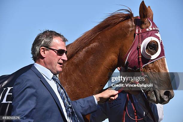 Trainer Darren Weir poses with Stratum Star after winning Race 6, the David Jones Cup during Caulfield Cup Day at Caulfield Racecourse on October 17,...