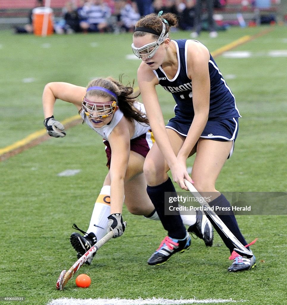 Cape's #4 Jane Coffrin fights with Yarmouth's #12 Hannah Peters for control of the ball as Cape Eliz