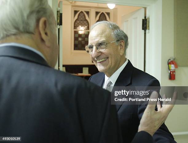 Sen. George Mitchell is greeted upon arriving at the Maine Irish Heritage Center in Portland on Wednesday night, October 10, 2012. Mitchell was being...