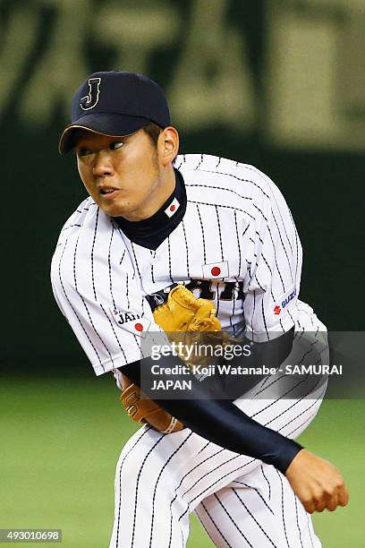 Yuki Nishi pitches during the game three of Samurai Japan and MLB All Stars at Tokyo Dome on November 15, 2014 in Tokyo, Japan.