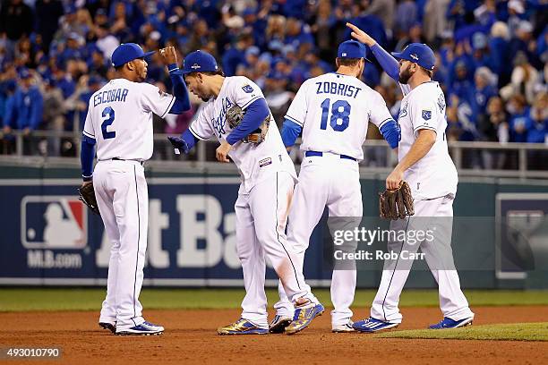 Alcides Escobar of the Kansas City Royals, Eric Hosmer of the Kansas City Royals, Ben Zobrist of the Kansas City Royals, and Mike Moustakas of the...