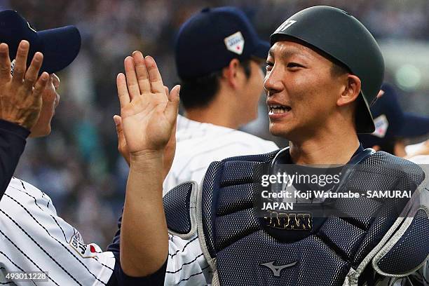 Motohiro Shima of Samurai Japan celebrates with his teammates during the game one of Samurai Japan and MLB All Stars at Kyocera Dome Osaka on...