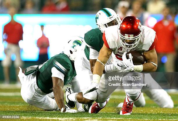 Kenneth Farrow of the Houston Cougars rushes the ball against the Tulane Green Wave at Yulman Stadium on October 16, 2015 in New Orleans, Louisiana.