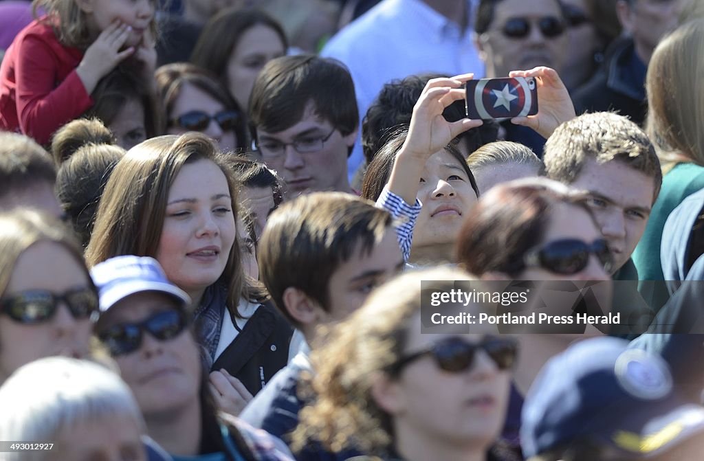 A supporter tries go get a photo of President Barack Obama at Veteran's Memorial Park in Manchester 