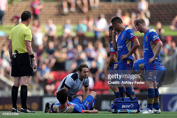 Labinot Haliti of the Jets lays on the ground injured during the round two A-League match between the Newcastle Jets and Sydney FC at Hunter Stadium...
