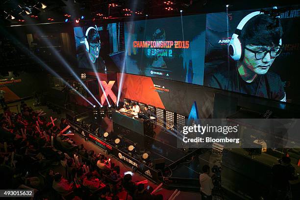 Fans watch as screens show Yang Jin Hyeob, a professional video-game player, competing against Jeong Se Hyun, not pictured, during the final round of...