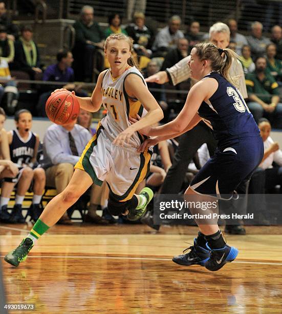 Western Maine class A girls basketball semifinal game between McAuley and Portland High Schools. McAuley's Olivia Smith drives the baseline around...