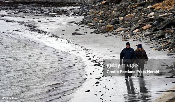 Doug Stewart of Cumberland walks with his mother Florence Stewart of Cape Elizabeth at Crescent Beach in Cape Elizabeth Monday, March 4, 2013.