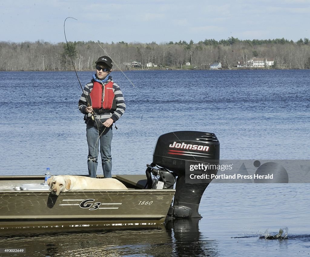 Wed. 04/14/2010. Kevin McKay has taught his two young sons to fly fish. 10 year old Tait hooks and p