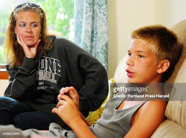 Sandra Watson, left and her son Dylan Young talk about synthetic drugs that mimic marijuana during an interview on Tuesday July 23, 2013 in Augusta....