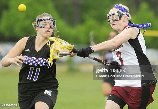 Tuesday, May 18, 2010 -- Gorham vs. Marshwood girls lacrosse game at Gorham. Gorham's#7, Shannon Wilcox, gets off a shot on goal while guarded by...