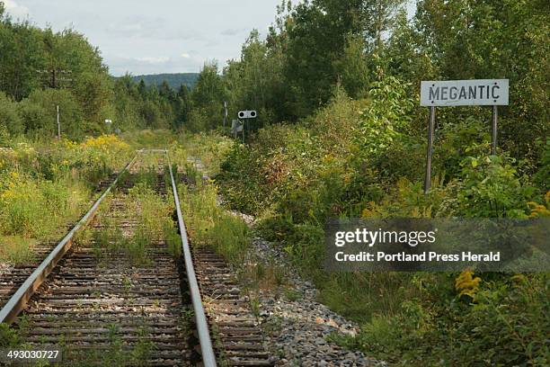 Sign alongside the Montreal, Maine & Atlantic Railway tell locomotive engineers they have arrived in Lac-Megantic, a town in Quebec about 22 miles...