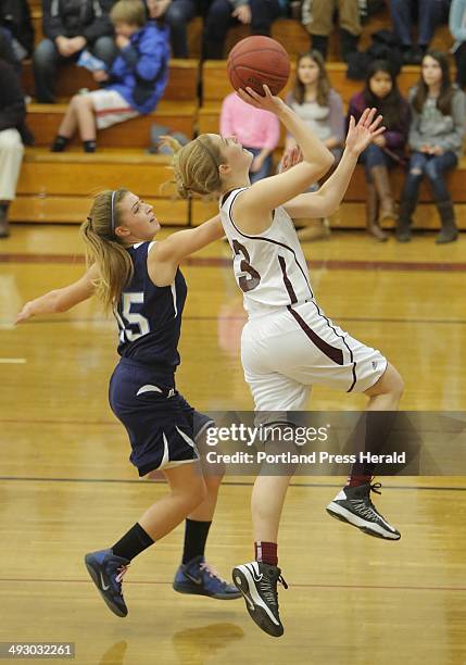 Jaclyn Storey of Greely puts up a shot ahead of Anne Graziano of York during a game at Greely on Friday, January 18, 2013.