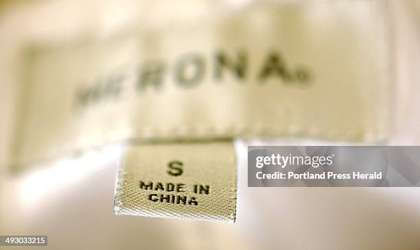 Jacket sold by an American relailer has a "Made in China" label inside, Thursday, July 25, 2013.