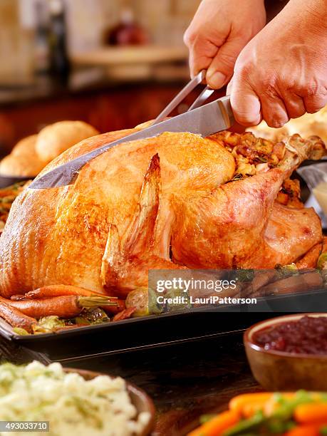 carving turkey dinner with stuffing and all the fixings - carvery stockfoto's en -beelden