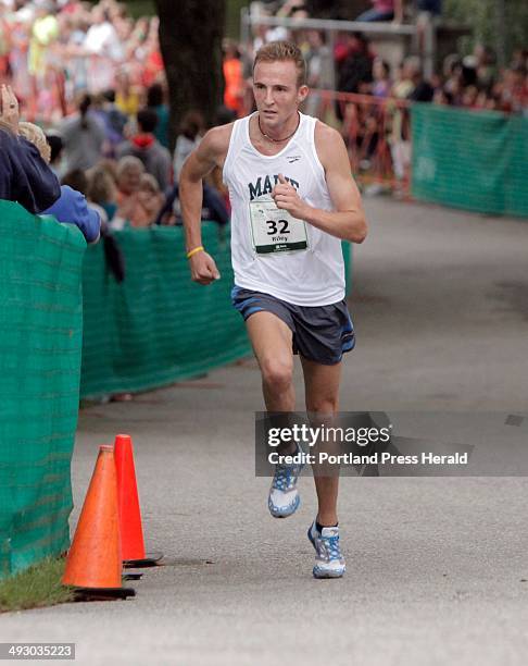 Riley Masters of Veazie runs up the hill at the entrance of Fort Williams Park during the TD Beach to Beacon 10K race in Cape Elizabeth on Saturday,...