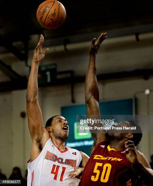 Maine's Fab Melo shoots over Michael Eric of the Canton Charge Sunday, March 10, 2013.