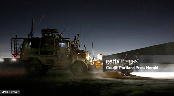 Members of the 133rd Engineer Battalion of the Maine Army National Guard depart a staging area at Bagram Air Field in a Mine Resistant Ambush...