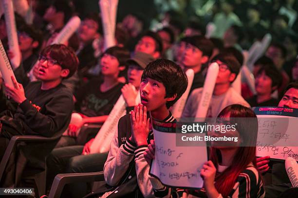 Fans react as they watch the final round of the Electronic Arts Inc. Sports FIFA Online Championship at the Nexon Co. E-Sports Stadium in Seoul,...