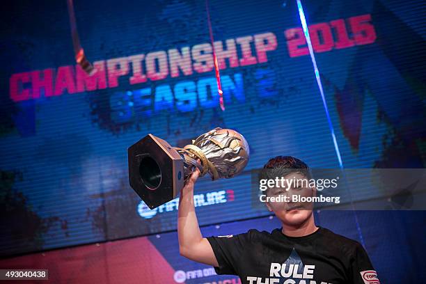 Yang Jin Hyeob, a professional video-game player, celebrates after winning the final round of the Electronic Arts Inc. Sports FIFA Online...