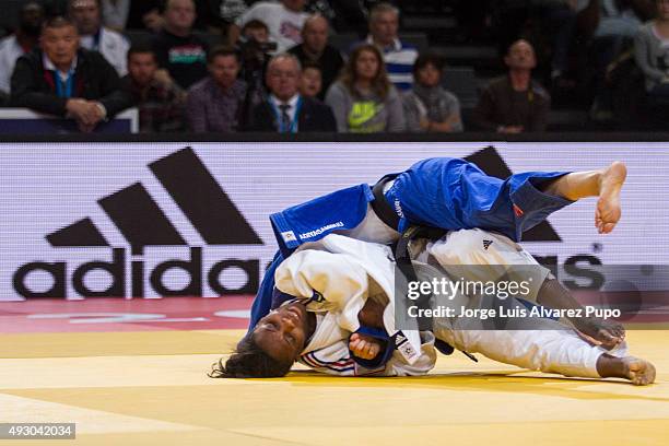 Priscilla Gneto of France attacks Tsolmon Adiyasambuu of Mongolia during the -52kg preliminary round of the Paris Grand Slam 2015 at the Palais...