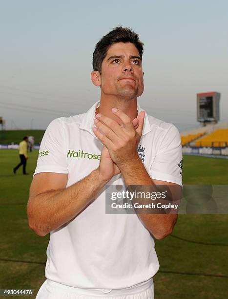 England captain Alastair Cook appauds the crowd after drawing the 1st Test between Pakistan and England at Zayed Cricket Stadium on October 17, 2015...