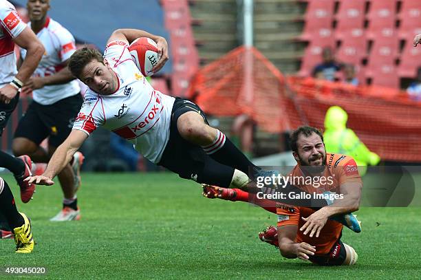 Niel Marris of the Cheetahs tackles Stokkies Hanekom of the Lions during the Absa Currie Cup semi final match between Xerox Golden Lions and Toyota...