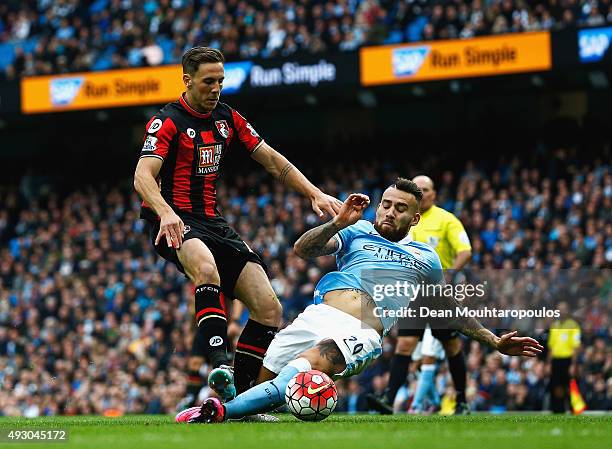 Simon Francis of Bournemouth and Nicolas Otamendi of Manchester City compete for the ball during the Barclays Premier League match between Manchester...