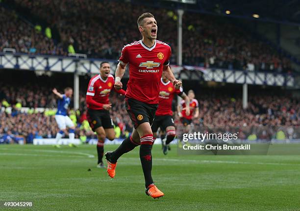 Morgan Schneiderlin of Manchester United celebrates scoring his team's first goal during the Barclays Premier League match between Everton and...