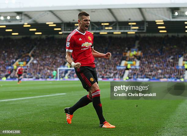 Morgan Schneiderlin of Manchester United celebrates scoring his team's first goal during the Barclays Premier League match between Everton and...