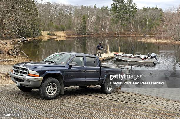 Wednesday, April 10, 2013S=?Sebago Lake public boat launch sites. Dan Hillier, of Naples, prepares to take out his boat at the boat launch at Sebago...