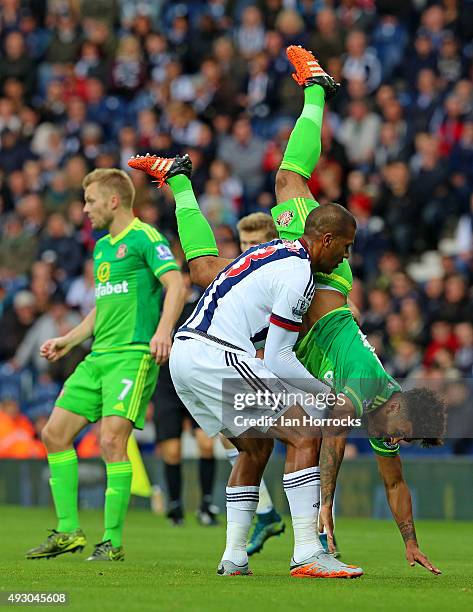 DeAndre Yedlin of Sunderland is held up by Salomon Rondon of West Bromwich Albion during the Barclays Premier League match between West Bromwich...