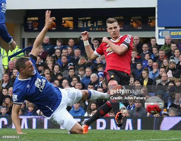 Morgan Schneiderlin of Manchester United scores their first goal during the Barclays Premier League match between Everton and Manchester United at...