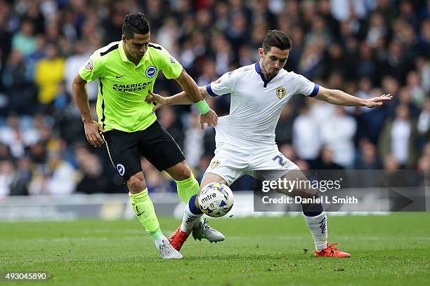 Liam Rosenior of Brighton & Hove Albion FC tackles Lewis Cook of Leeds United FC during the Sky Bet Championship match between Leeds United and...