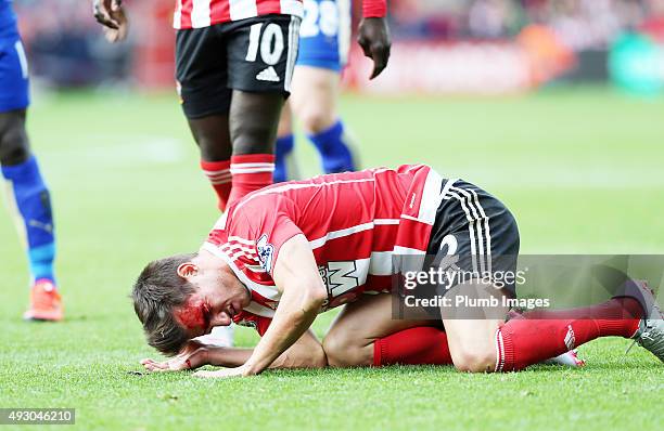 Cedric Soares of Southampton bleeds from a nasty cut after a clash of heads during the Premier League match between Southampton and Leicester City at...