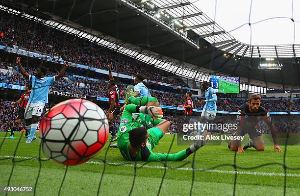 Raheem Sterling of Manchester City scores his team's first goal past Adam Federici of Bournemouth during the Barclays Premier League match between...