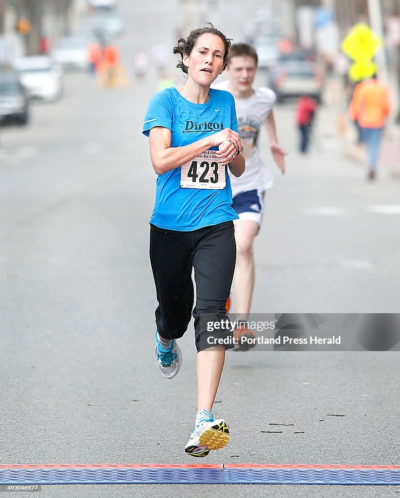 Women's winner Meredith Anderson of Portland crosses the finish line during the 84th Boys and Girls