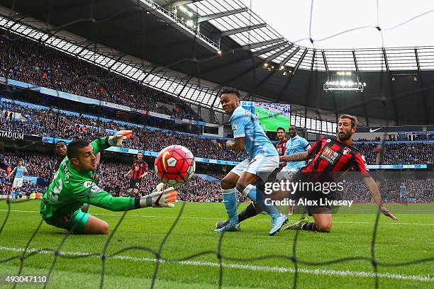 Raheem Sterling of Manchester City scores his team's first goal past Adam Federici of Bournemouth during the Barclays Premier League match between...