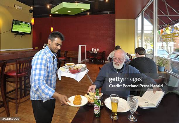 Thursday, April 19, 2012. Dine Out Maine art from the Dancing Elephant restaurant at 855 Main St., Westbrook. Owner, Iqubal Hossain delivers food to...