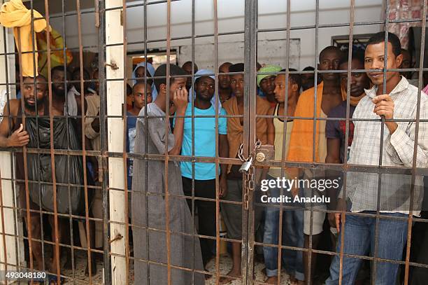 Refugees are seen at a makeshift detention center in the outskirts of Misrata, Libya on October 16, 2015. Approximately 1.500 refugees from Egypt,...