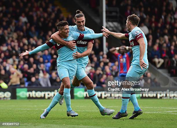 Manuel Lanzini of West Ham United celebrates scoring his team's second goal with his team mates Andy Carroll and Aaron Cresswell during the Barclays...