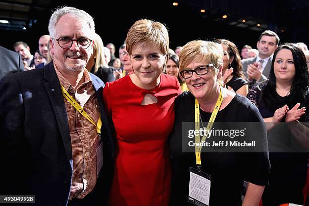 First Minister of Scotland Nicola Sturgeon stands with her mum Joan and dad Robin following her keynote speech at the 81st annual SNP conference at...