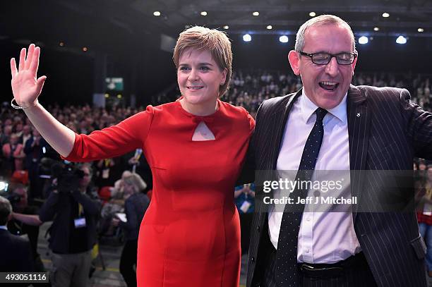 First Minister of Scotland Nicola Sturgeon and Stewart Hosie MP deputy leader acknowledge applause following the SNP leader's keynote speech during...