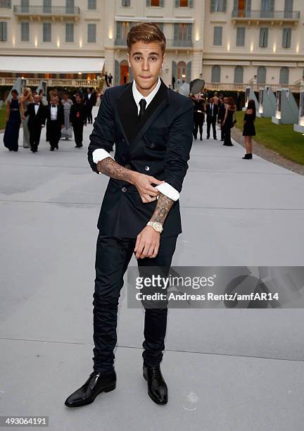 Justin Bieber attends amfAR's 21st Cinema Against AIDS Gala Presented By WORLDVIEW, BOLD FILMS, And BVLGARI at Hotel du Cap-Eden-Roc on May 22, 2014...